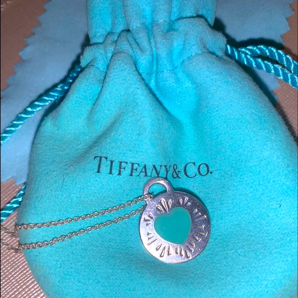 Rare Tiffany & Co round pendant necklace with Tiffany blue heart detail.